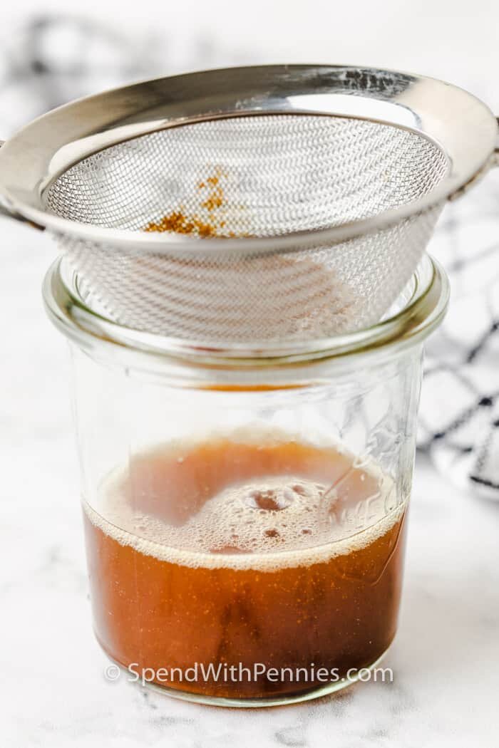 using a strainer to show How to Make Brown Butter