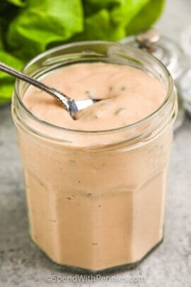 Thousand Island Dressing being scooped out of a jar