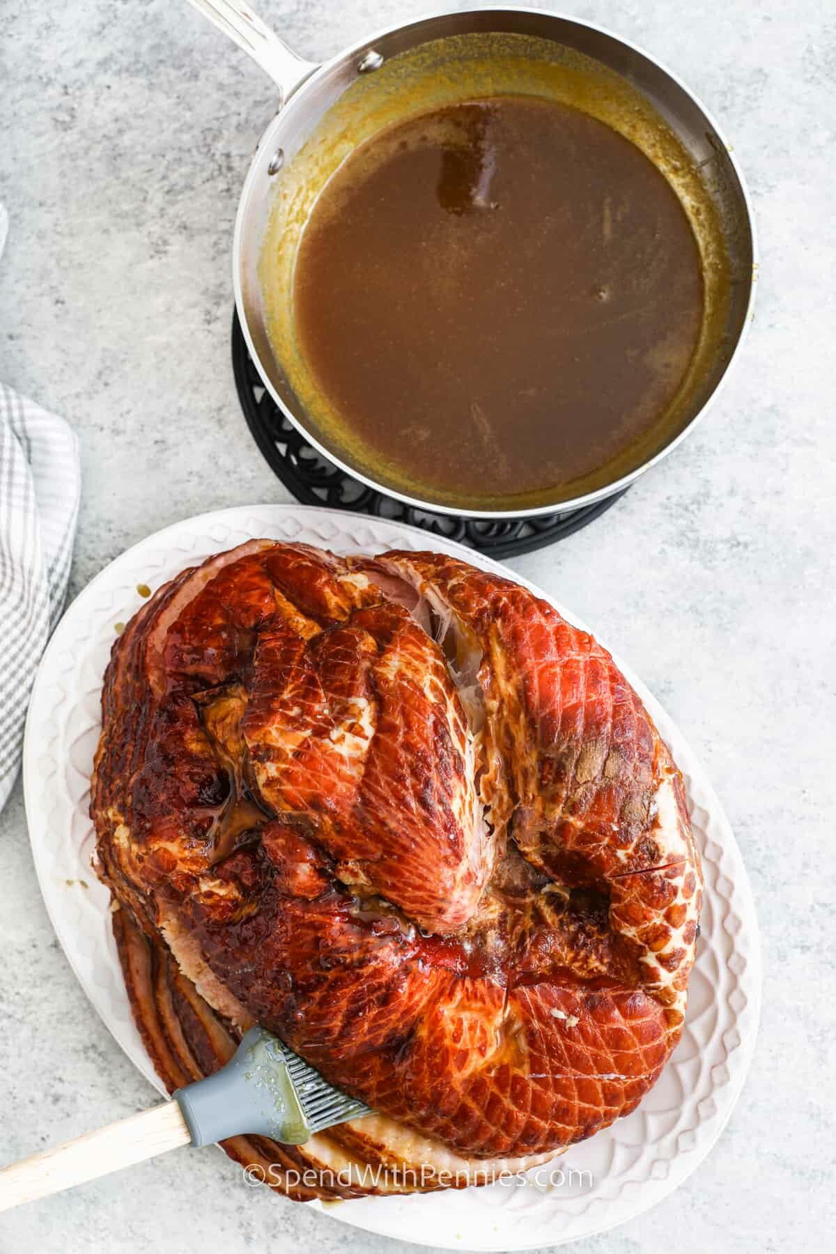 adding glaze to Crock Pot Ham